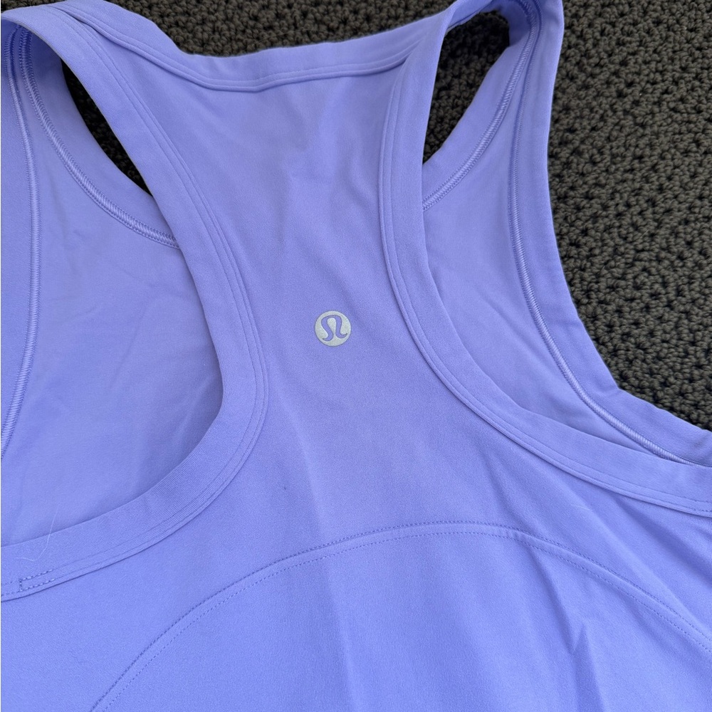 Light purple Lululemon align Waist-length racerback tank top.